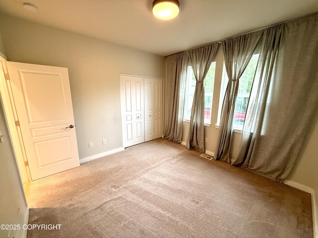 14740 Maxwell Pl, Anchorage, AK 99516 - unfurnished bedroom with carpet flooring, a closet, and baseboards