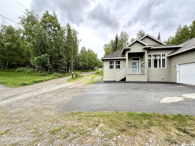 14740 Maxwell Pl, Anchorage, AK 99516 - view of front of house with asphalt driveway and roof with shingles