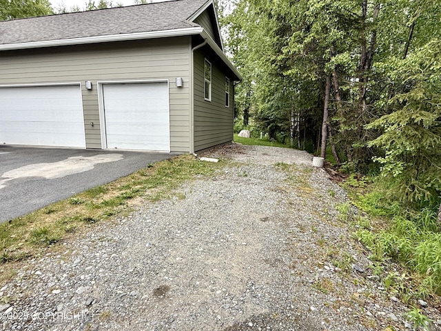 14740 Maxwell Pl, Anchorage, AK 99516 - view of side of property with driveway and a shingled roof