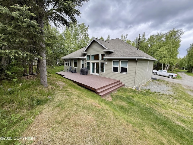 14740 Maxwell Pl, Anchorage, AK 99516 - rear view of house featuring a wooden deck, a yard, and roof with shingles