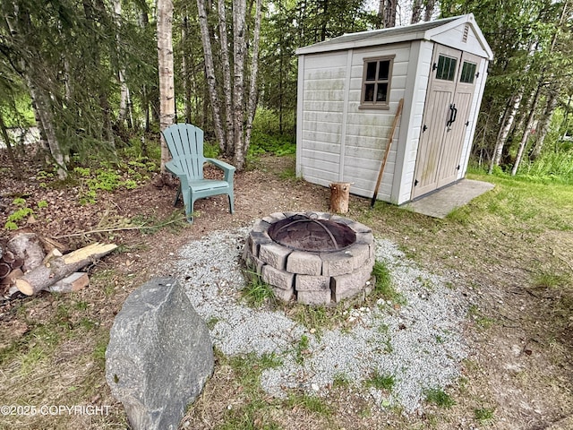 14740 Maxwell Pl, Anchorage, AK 99516 - view of shed featuring an outdoor fire pit
