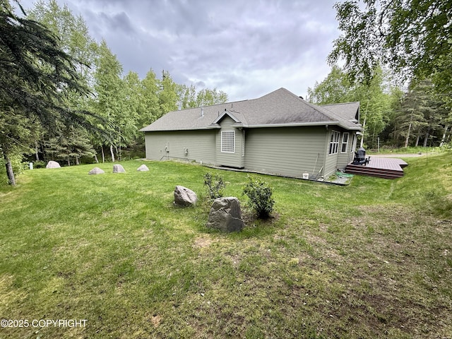 14740 Maxwell Pl, Anchorage, AK 99516 - view of property exterior with a deck, a yard, and a shingled roof
