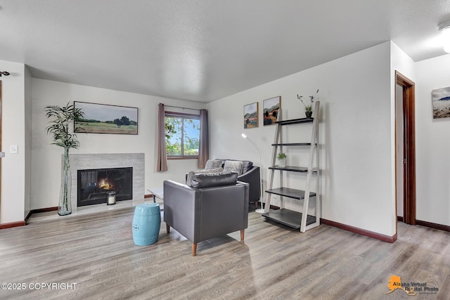 4221 Folker St # F203, Anchorage, AK 99508 - living room with wood finished floors and a high end fireplace