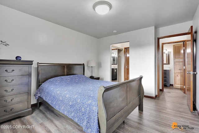 4221 Folker St # F203, Anchorage, AK 99508 - bedroom featuring wood finished floors and connected bathroom