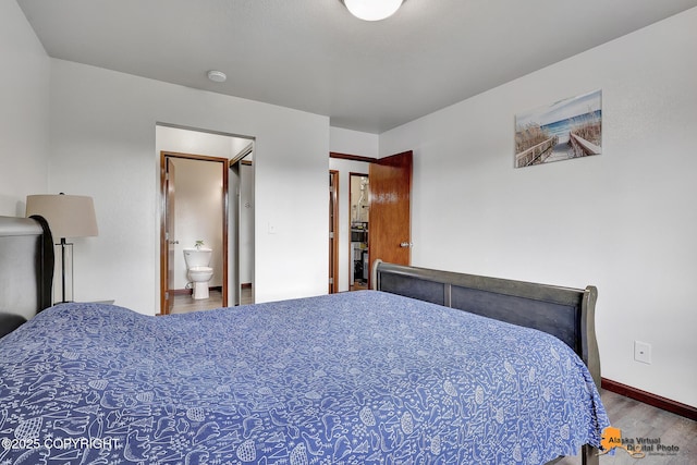 4221 Folker St # F203, Anchorage, AK 99508 - bedroom featuring wood finished floors and connected bathroom