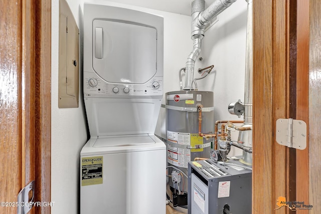 4221 Folker St # F203, Anchorage, AK 99508 - washroom featuring estacked washer and dryer and strapped water heater