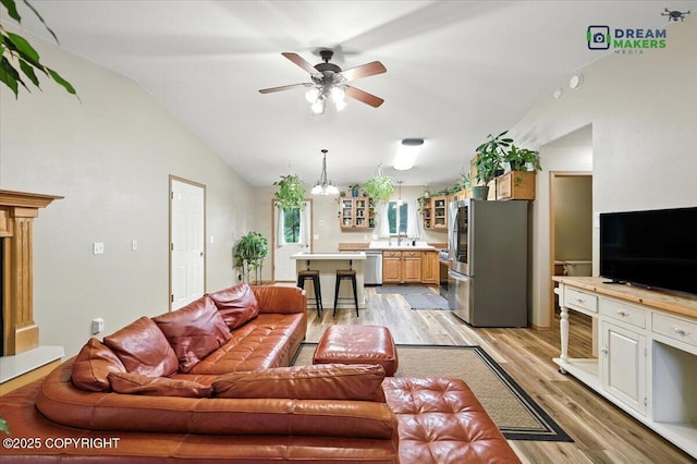 8520 E Gold Bullion Blvd, Palmer, AK 99645 - living area featuring vaulted ceiling, light wood-type flooring, and a ceiling fan