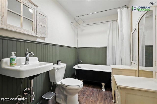 8520 E Gold Bullion Blvd, Palmer, AK 99645 - full bathroom with a wainscoted wall, a freestanding bath, and wood finished floors