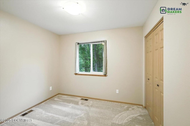 8520 E Gold Bullion Blvd, Palmer, AK 99645 - unfurnished bedroom featuring carpet flooring and a closet