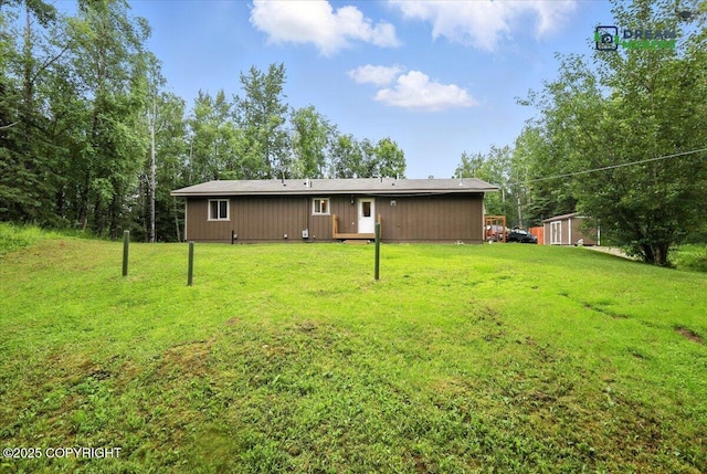 8520 E Gold Bullion Blvd, Palmer, AK 99645 - back of property featuring a yard