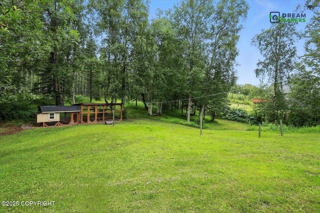 8520 E Gold Bullion Blvd, Palmer, AK 99645 - view of grassy yard with an outbuilding and exterior structure