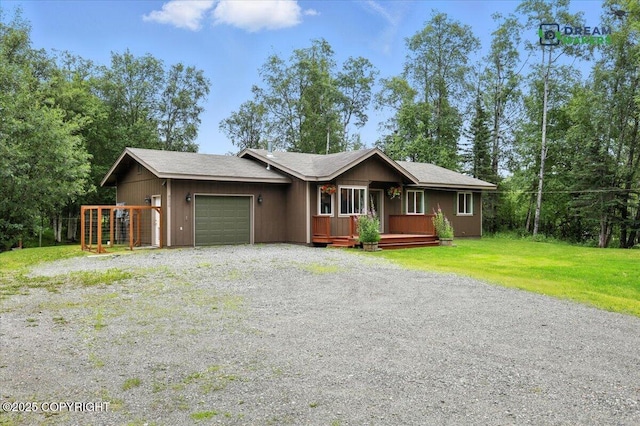 8520 E Gold Bullion Blvd, Palmer, AK 99645 - view of front of home featuring an attached garage, gravel driveway, and a front yard