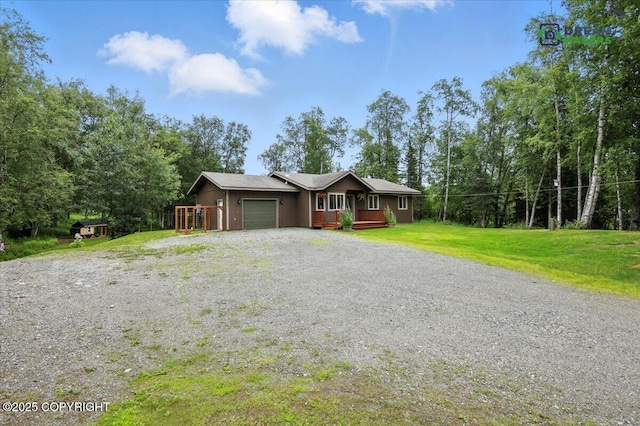 8520 E Gold Bullion Blvd, Palmer, AK 99645 - view of front of house featuring a garage, gravel driveway, and a front yard