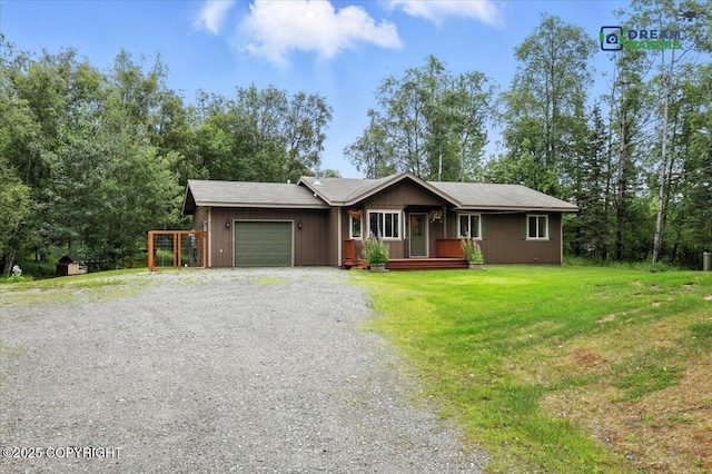 8520 E Gold Bullion Blvd, Palmer, AK 99645 - view of front of home with a garage, gravel driveway, and a front lawn