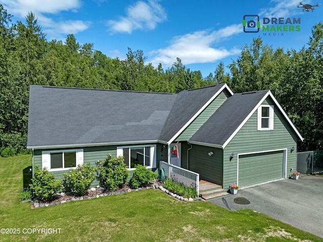 3111 N Intuition Dr, Wasilla, AK 99654 - view of front of house featuring driveway, a front lawn, a porch, and roof with shingles