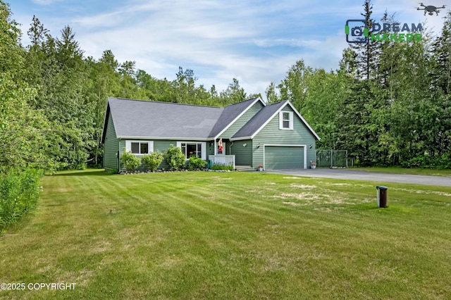 3111 N Intuition Dr, Wasilla, AK 99654 - view of front facade with asphalt driveway, a garage, and a front yard