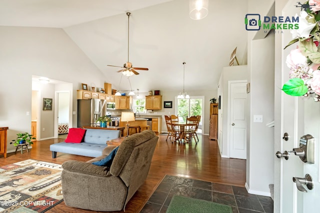 3111 N Intuition Dr, Wasilla, AK 99654 - living area with high vaulted ceiling, ceiling fan, and dark wood-style flooring