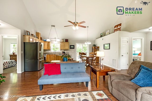 3111 N Intuition Dr, Wasilla, AK 99654 - living area with dark wood finished floors, high vaulted ceiling, and a ceiling fan