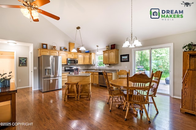 3111 N Intuition Dr, Wasilla, AK 99654 - dining space with high vaulted ceiling, a chandelier, ceiling fan, and dark wood-style flooring