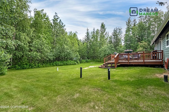 3111 N Intuition Dr, Wasilla, AK 99654 - view of grassy yard featuring a deck