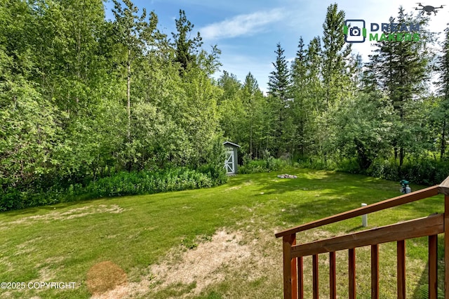 3111 N Intuition Dr, Wasilla, AK 99654 - view of grassy yard featuring a storage unit