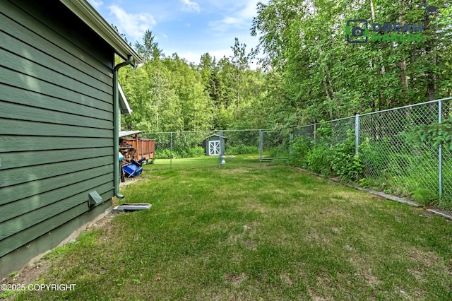3111 N Intuition Dr, Wasilla, AK 99654 - fenced backyard featuring a storage unit and a forest view