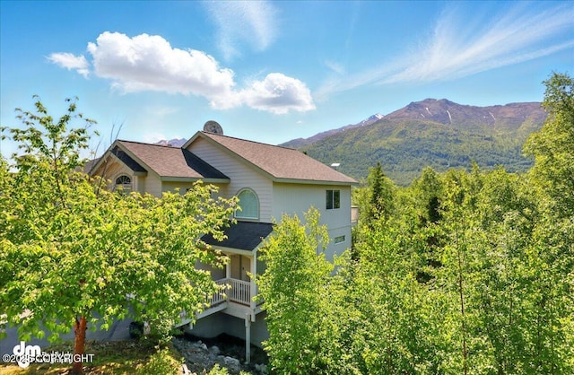 9198 Eagle River Ln, Eagle River, AK 99577 - view of side of home with a mountain view