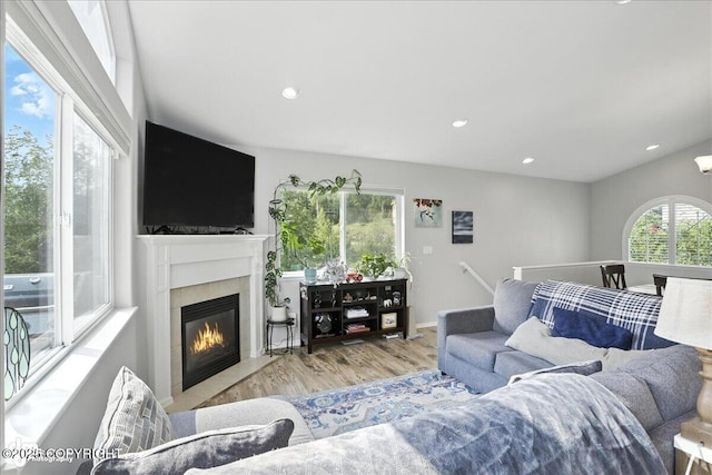 9198 Eagle River Ln, Eagle River, AK 99577 - living room with a fireplace, wood finished floors, and recessed lighting