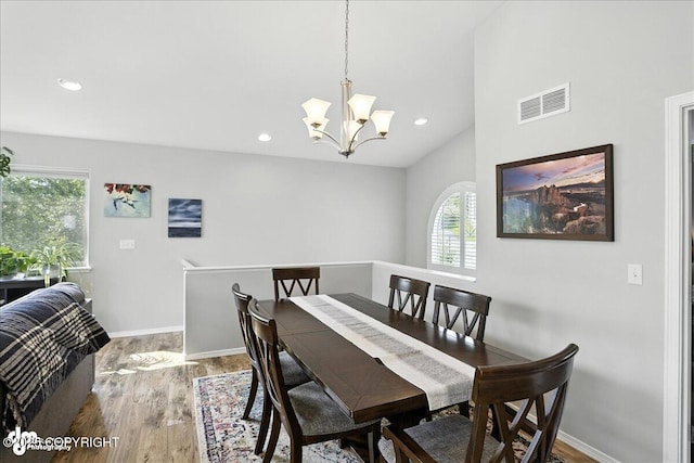 9198 Eagle River Ln, Eagle River, AK 99577 - dining area featuring wood finished floors, a chandelier, lofted ceiling, and recessed lighting