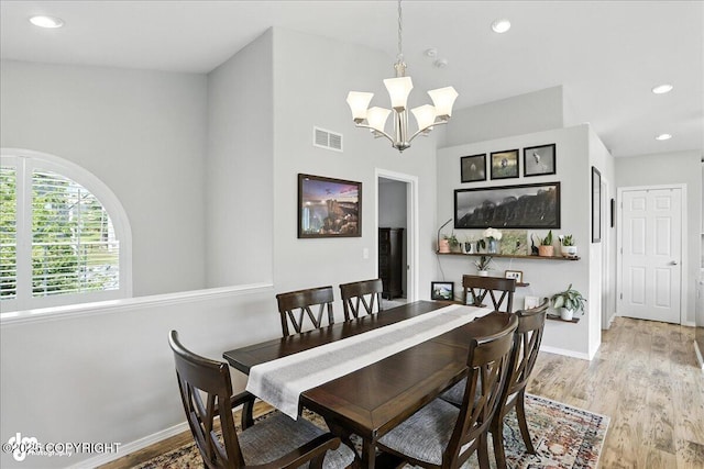 9198 Eagle River Ln, Eagle River, AK 99577 - dining area with a chandelier, light wood-type flooring, and recessed lighting