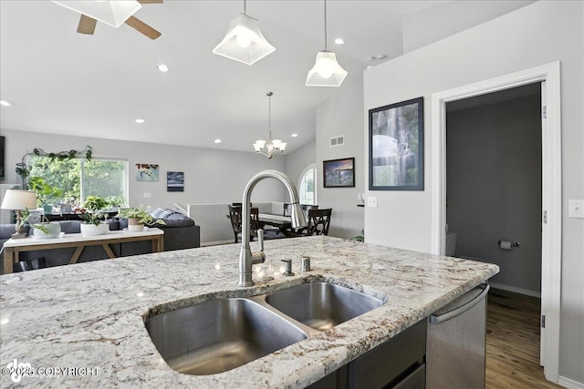 9198 Eagle River Ln, Eagle River, AK 99577 - kitchen featuring dishwasher, wood finished floors, pendant lighting, recessed lighting, and light stone countertops