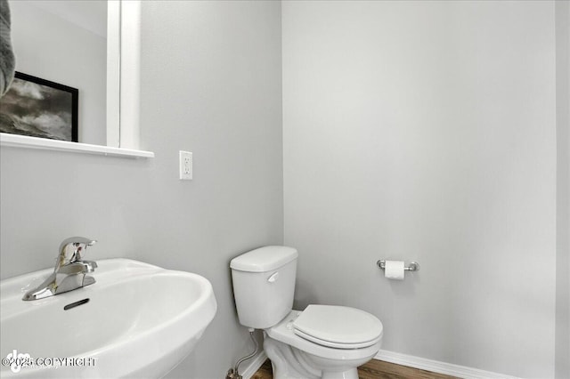 9198 Eagle River Ln, Eagle River, AK 99577 - bathroom featuring a sink and wood finished floors
