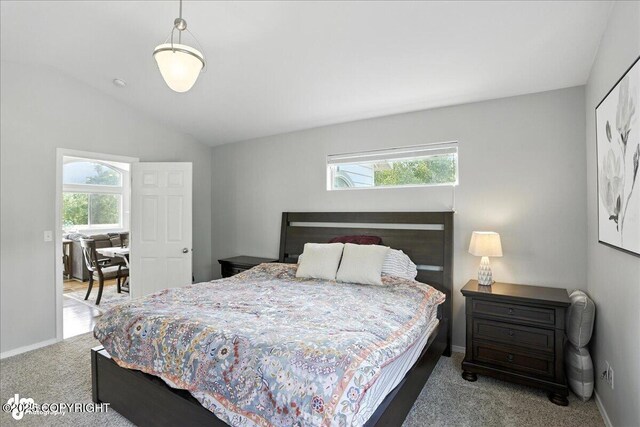 9198 Eagle River Ln, Eagle River, AK 99577 - bedroom with carpet flooring and vaulted ceiling