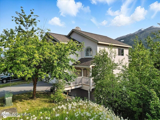 9198 Eagle River Ln, Eagle River, AK 99577 - view of home's exterior featuring a porch and a mountain view
