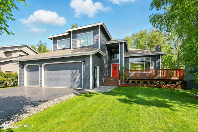 17001 Yellowstone Dr, Eagle River, AK 99577 - view of front of property with driveway, a front lawn, a chimney, a wooden deck, and an attached garage