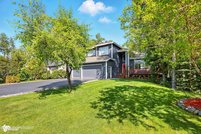 17001 Yellowstone Dr, Eagle River, AK 99577 - view of front of house featuring driveway, a garage, a front yard, and a deck