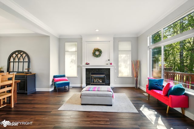 17001 Yellowstone Dr, Eagle River, AK 99577 - living room with plenty of natural light, ornamental molding, a tiled fireplace, recessed lighting, and dark wood-style floors