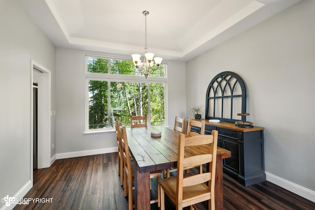 17001 Yellowstone Dr, Eagle River, AK 99577 - dining area with a raised ceiling, a chandelier, and dark wood-type flooring