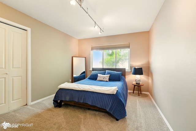 17001 Yellowstone Dr, Eagle River, AK 99577 - carpeted bedroom with track lighting and baseboards
