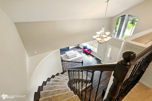 17001 Yellowstone Dr, Eagle River, AK 99577 - staircase featuring a chandelier and high vaulted ceiling