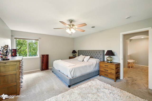 17001 Yellowstone Dr, Eagle River, AK 99577 - bedroom with carpet flooring, arched walkways, and ceiling fan