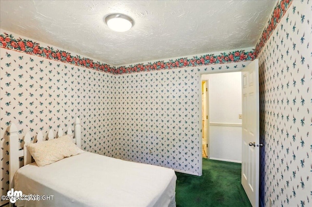 19807 First St, Eagle River, AK 99577 - bedroom with dark colored carpet, a textured ceiling, and wallpapered walls
