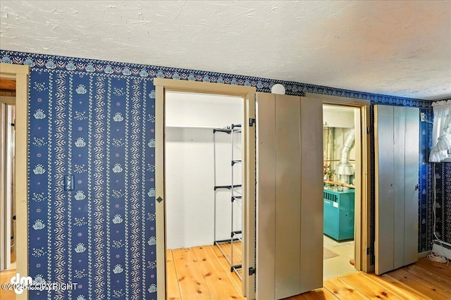 19807 First St, Eagle River, AK 99577 - bathroom with hardwood / wood-style flooring and a textured ceiling