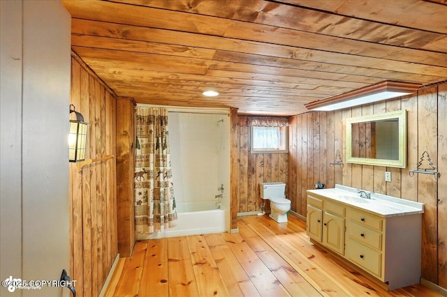 19807 First St, Eagle River, AK 99577 - bathroom featuring wood ceiling, vanity, hardwood / wood-style flooring, wooden walls, and shower / tub combo