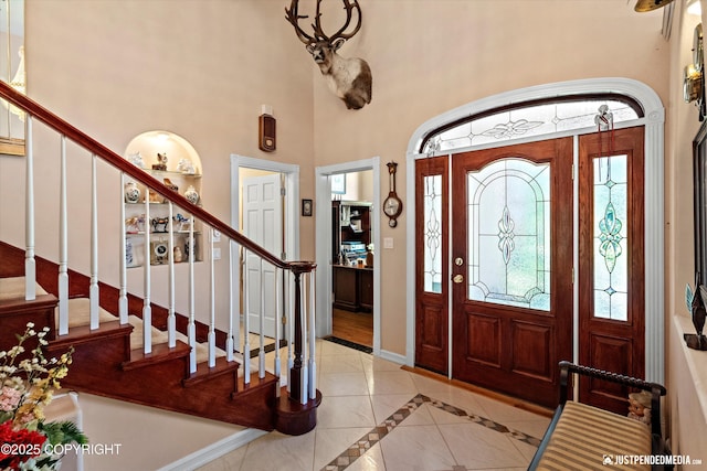2215 S Austin Cir, Palmer, AK 99645 - foyer featuring stairs, inlaid floor details, and a high ceiling