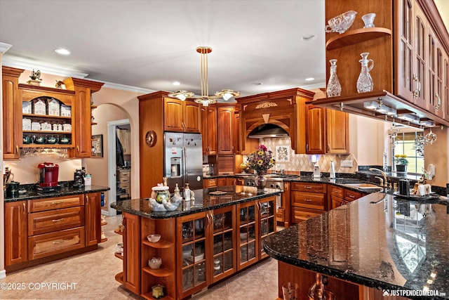 2215 S Austin Cir, Palmer, AK 99645 - kitchen with open shelves, stainless steel fridge, arched walkways, crown molding, and a center island