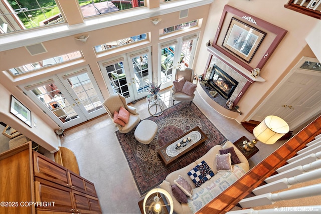 2215 S Austin Cir, Palmer, AK 99645 - living area with french doors, a glass covered fireplace, and a high ceiling