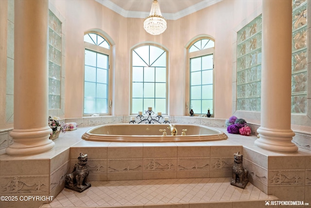 2215 S Austin Cir, Palmer, AK 99645 - bathroom featuring plenty of natural light, ornamental molding, a garden tub, tile patterned flooring, and ornate columns