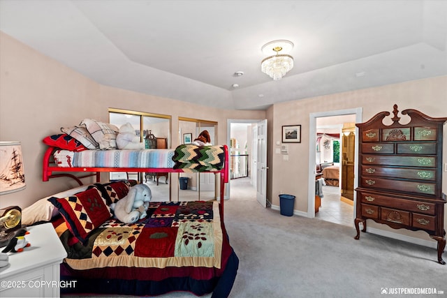 2215 S Austin Cir, Palmer, AK 99645 - bedroom featuring carpet flooring, a tray ceiling, and a chandelier