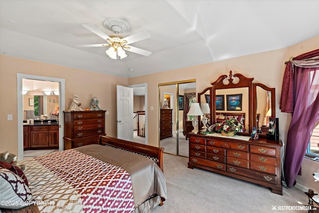 2215 S Austin Cir, Palmer, AK 99645 - bedroom featuring light colored carpet, a closet, connected bathroom, and ceiling fan
